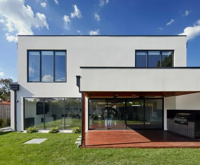 Illustrative home and lawn in a legacy website layout